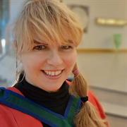 woman looking at the camera and smiling